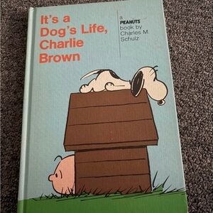 It’s a dog’s life Charlie Brown by Charles m Schultz